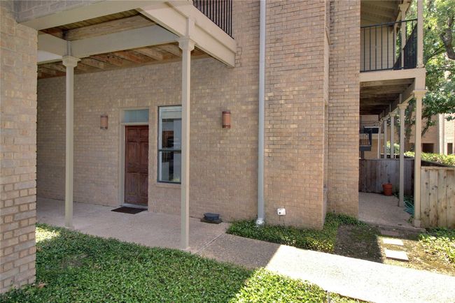 Covered, 1st Floor Entry with private courtyard off Living, and showing Balcony upstairs. | Image 13