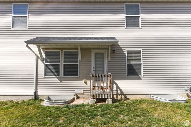 Property entrance featuring a lawn | Image 35