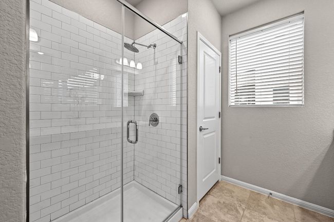 Clean lines and modern design define the ensuite, where you’ll enjoy both practicality and style | Image 20