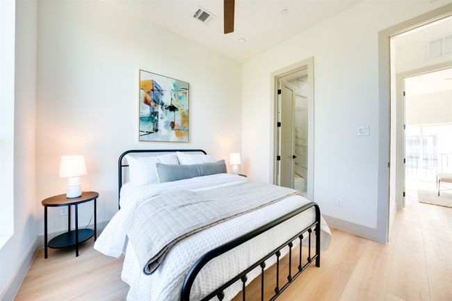Bedroom featuring light hardwood / wood-style floors and ceiling fan | Image 24