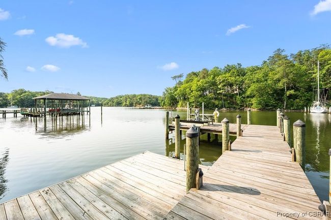 Dock featuring a water view | Image 11