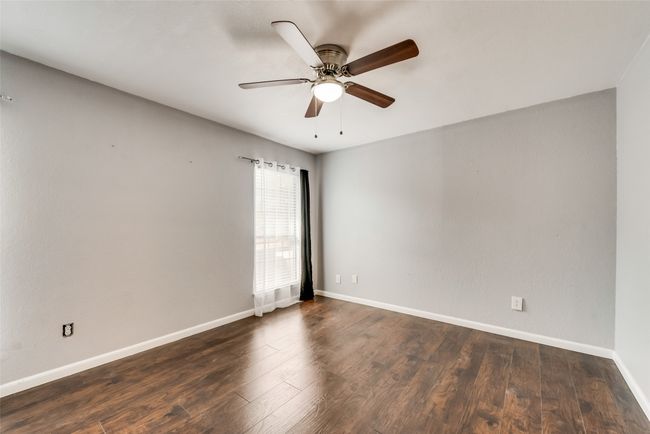Empty room featuring wood finished floors and ceiling fan | Image 12