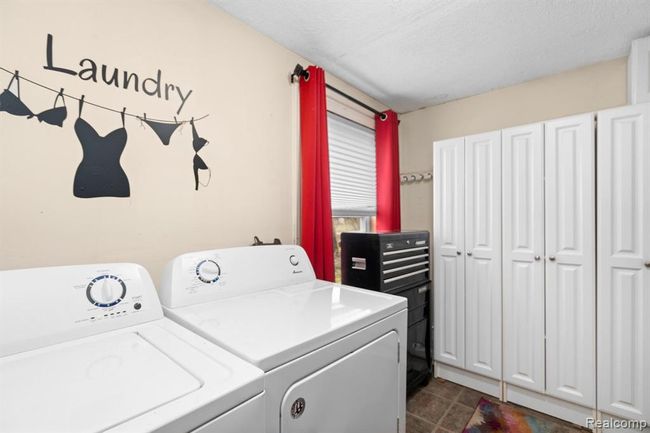 Laundry with Cabinets for storage | Image 16