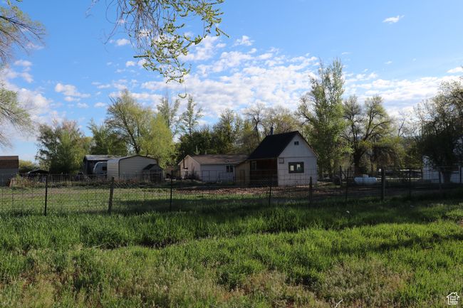 View of yard with fence | Image 38