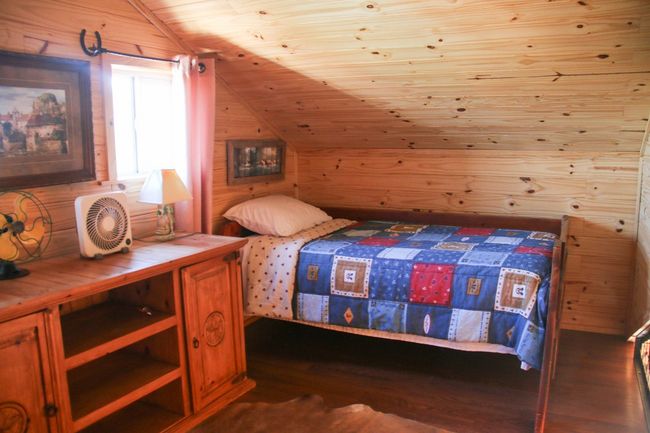The loft of the tiny home has two beds. So cozy! | Image 29