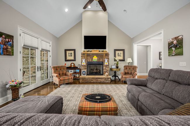 This open concept floor plan is designed with family gatherings and entertaining in mind, allowing for easy conversation flow and interaction between the cozy family room and the modern kitchen. | Image 34