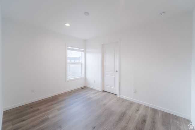 Unfurnished bedroom featuring recessed lighting, baseboards, and wood finished floors | Image 12