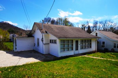 1441 living square feet two bedrooms, one bathroom with a 741 square feet unfinished walkout basement located across the street form Mercy Health - Marcum and Wallace Hospital! | Image 1