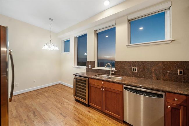 A bistro table fits nicely in the corner of this kitchen. | Image 16