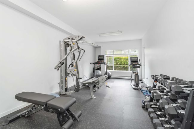 Workout area featuring a baseboard radiator and baseboards | Image 28