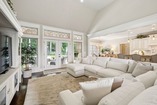 Cozy Great Room fully open to the kitchen and breakfast nook while overlooking the peaceful wooded back drop of the private back yard... | Image 10