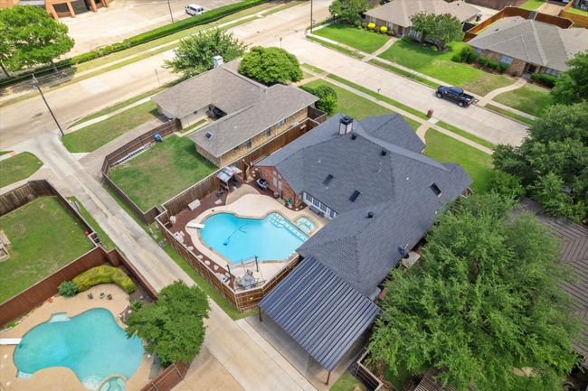 Aerial perspective of suburban area featuring a pool area | Image 39