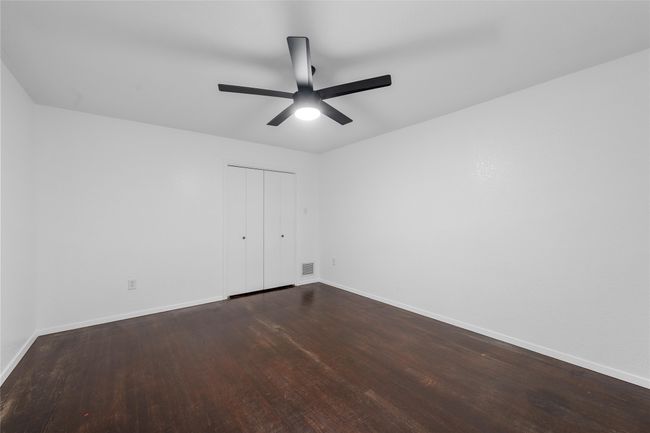 Unfurnished room with baseboards, wood finished floors, and a ceiling fan | Image 19