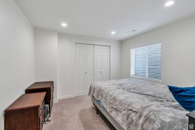 Bedroom featuring recessed lighting, light colored carpet, and a closet | Image 19
