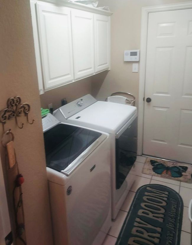 Laundry room equipped for future washer and dryer with plenty of storage space. | Image 28