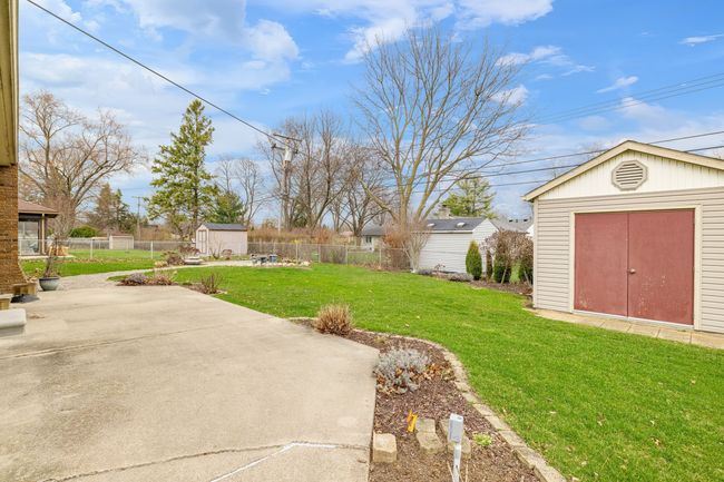 Landscaped backyard with shed | Image 42