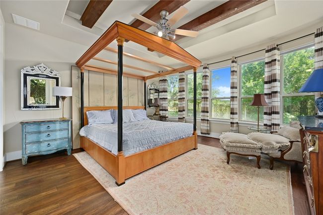 Bedroom with wood floors and beamed ceiling | Image 12