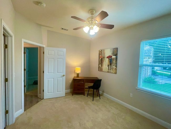 Secondary bedroom has door access to full bath. | Image 11