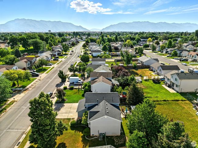 Aerial view of residential area featuring a mountain backdrop | Image 32