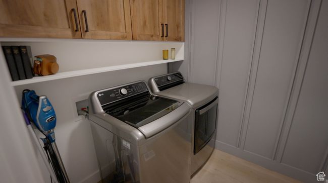 Enjoy extra storage with closed cabinets, an open shelf for easy access, and a beautiful accent wall that brings style to your daily routine. Should your laundry room be boring, of course not! | Image 28