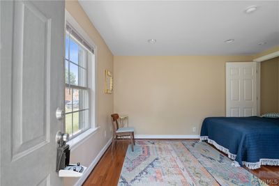 Bedroom featuring wood flooring, great natural light | Image 3