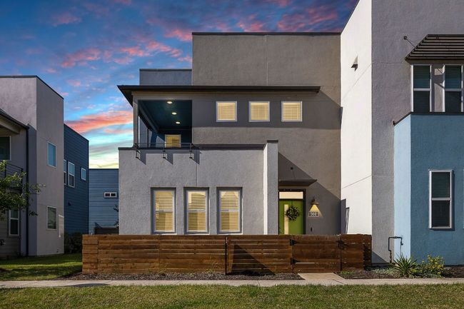 View of front of property featuring a fenced front yard and stucco siding | Image 6