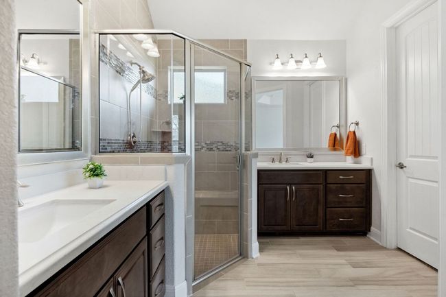 Full bath with a sink, two vanities, and a shower stall | Image 24