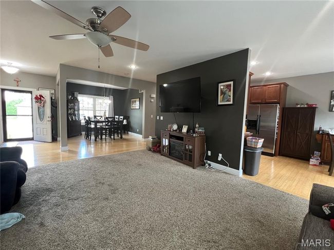 Living room featuring ceiling fan, light wood-type flooring, and recessed lighting | Image 20