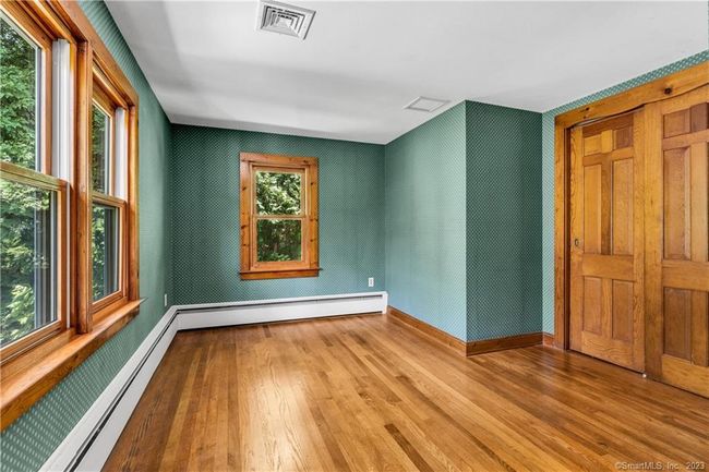 Bedroom #3 also has a large back window, double closet, and attractive hardwood floors. | Image 20