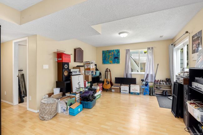 ABOVE GROUND LOWER LEVEL FAMILY ROOM 16'3X12'2 SLIDING GLASS DOOR AND MAN DOOR TO OUTSIDE PATIO | Image 23