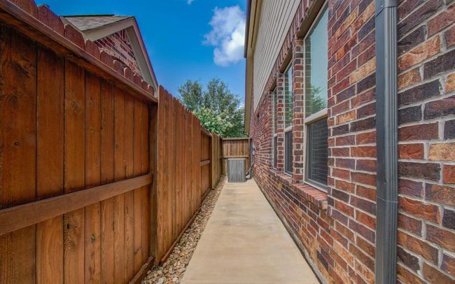 Side concrete path to front. | Image 44