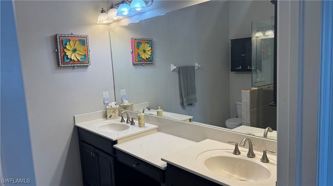 Bathroom with double vanity and toilet | Image 7