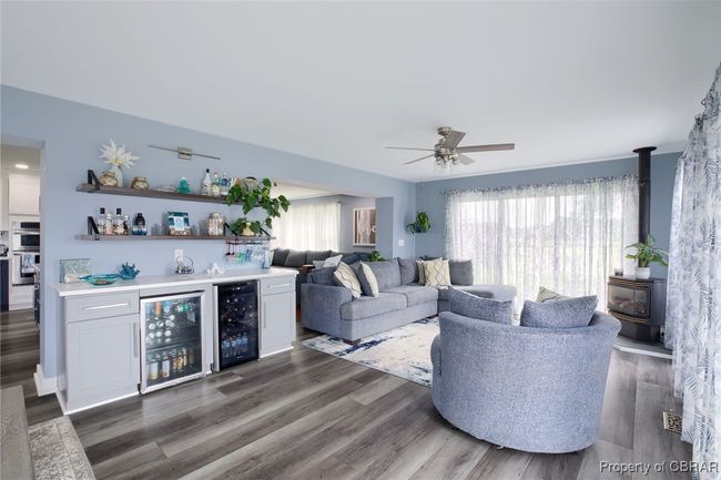 Living room with indoor bar, wine cooler, and a healthy amount of sunlight | Image 35
