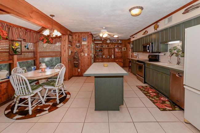 576 Sw Rustic Cir, House other with 3 bedrooms, 2 bathrooms and null parking in Stuart FL | Image 12