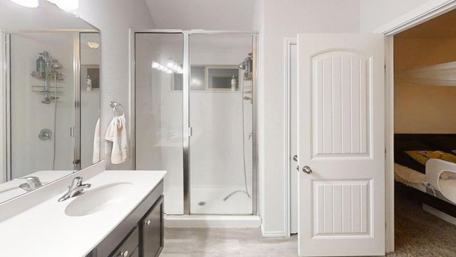 Full bathroom with connected bathroom, a shower stall, and vanity | Image 27