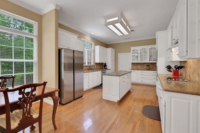 Natural lighting illuminates the open kitchen | Image 15