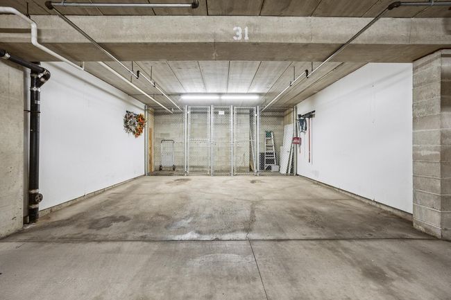 Two Car (19' x 19') underground heated garage stalls and 19' x 4' lockable storage area | Image 25