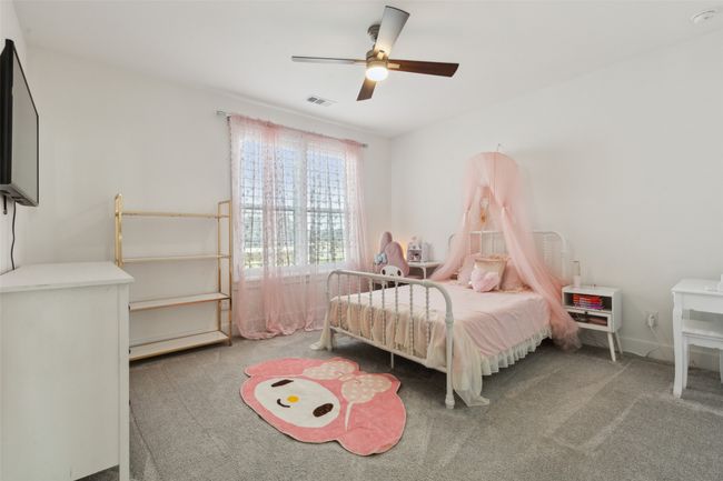 Carpeted bedroom with ceiling fan | Image 25