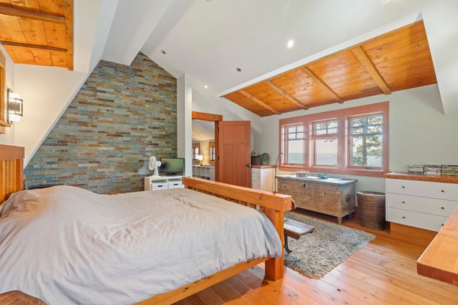 Bedroom featuring light wood-style floors and wood ceiling | Image 19
