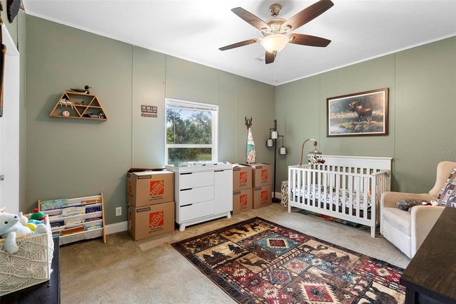 Bedroom 3 with walk-in closet overlooking the side yard | Image 24