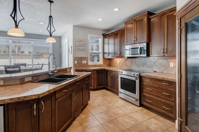238 Kingsbury View Se, Home with 4 bedrooms, 3 bathrooms and 4 parking in Airdrie AB | Image 13