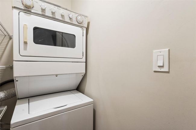 Laundry room with stacked washer / drying machine | Image 26
