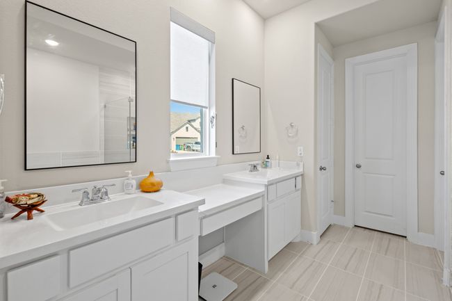 Full bathroom featuring a sink, two vanities, walk in shower, and tile patterned flooring | Image 15