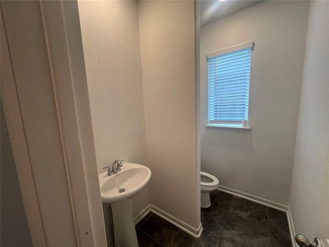 Bathroom featuring toilet and tile patterned floors | Image 18