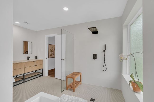Bathroom with a walk in shower, visible vents, recessed lighting, and vanity | Image 26