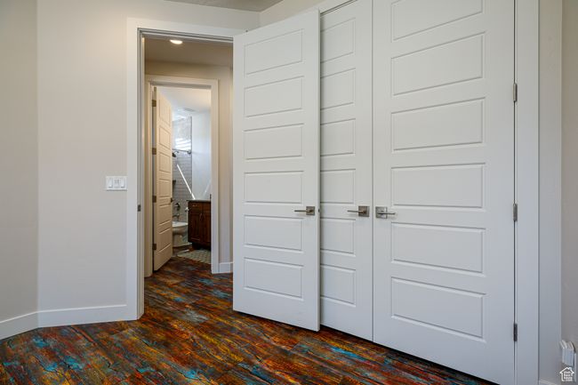 2nd Bedroom with a closet, dark wood-style floors, and baseboards | Image 27