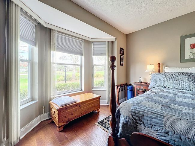 Primary bedroom large bay window invites daylight into the spacious room | Image 28