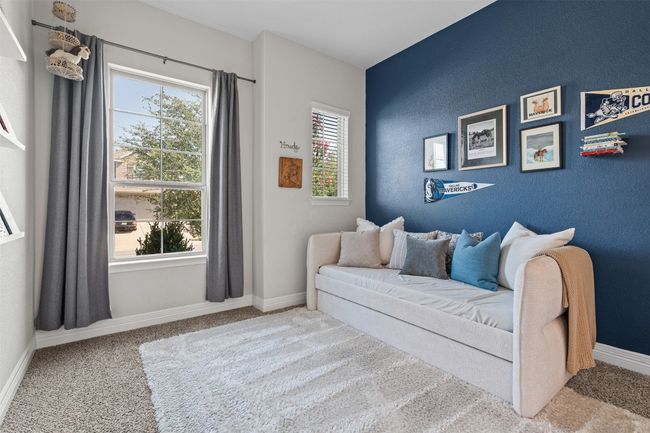 Two secondary bedrooms paired together near the downstairs bathroom | Image 15