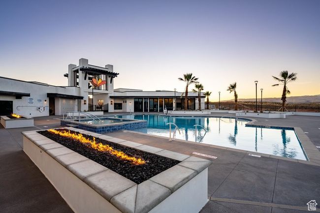 Community pool featuring an outdoor fire pit and a patio | Image 33