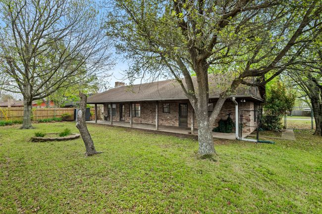 View of backyard featuring fence and a patio | Image 4